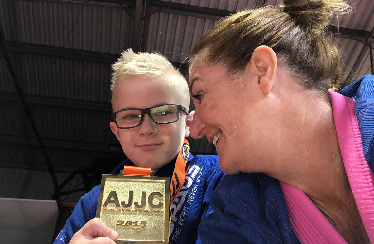 Queenie Warhurst and Jax Gardiner with his award