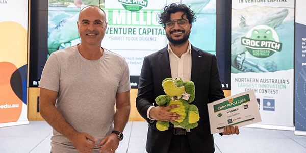 Winner of Croc Pitch presented with a plush toy crocodile