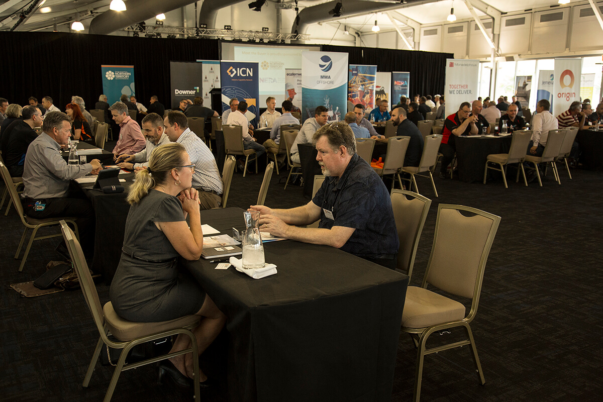 Two people chatting at an industry networking event