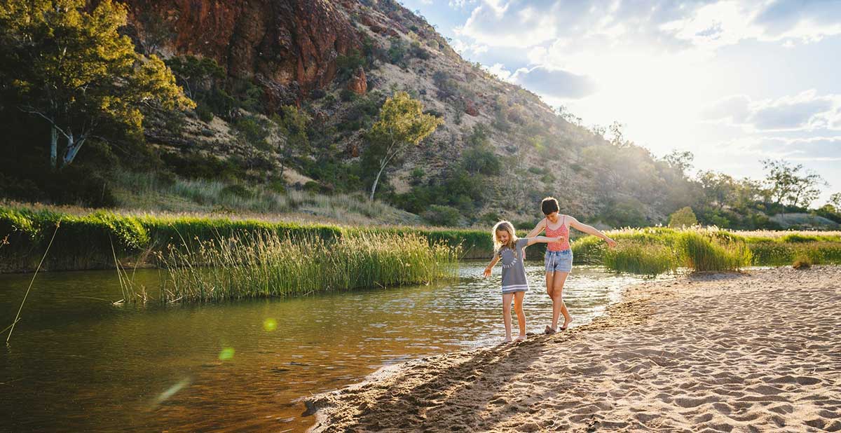 Children playing at waters edge