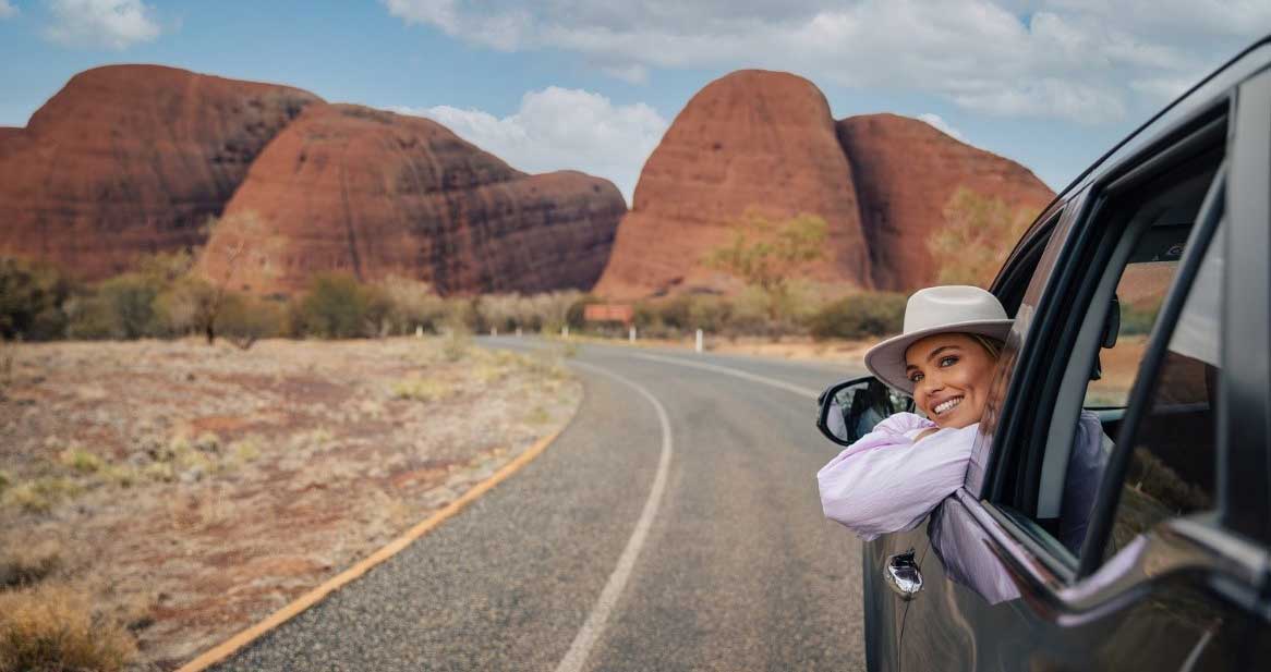 Car driving towards Uluru