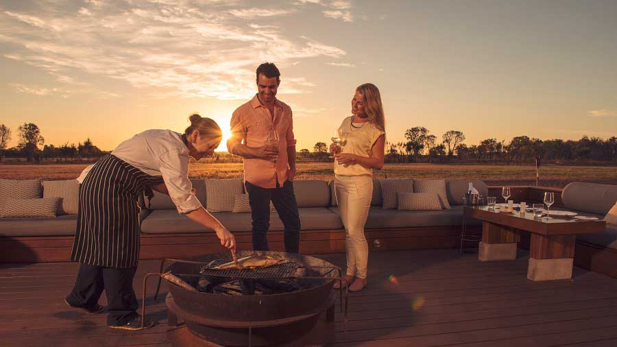 Couple experiencing outdoor dining at sunset