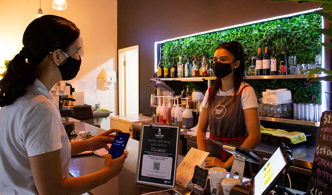 Woman checking-in at a cafe