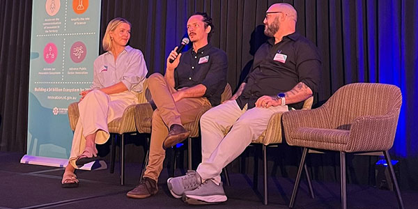 People speaking at a panel for activating innovation