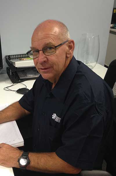 Grant Butler sitting at his desk