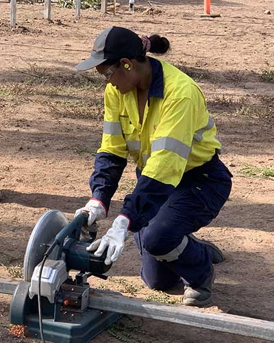 Trainee learning how to use a drop-saw