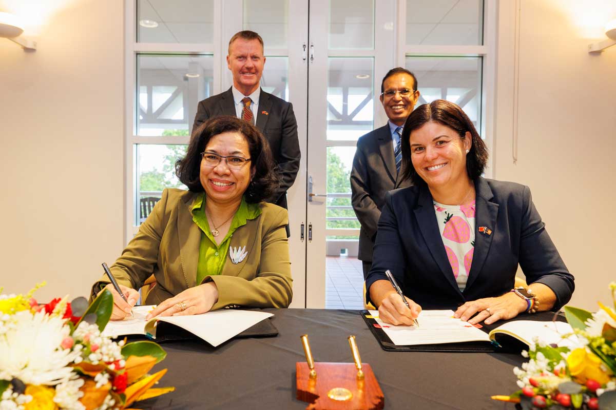 Group shot of agreement signing