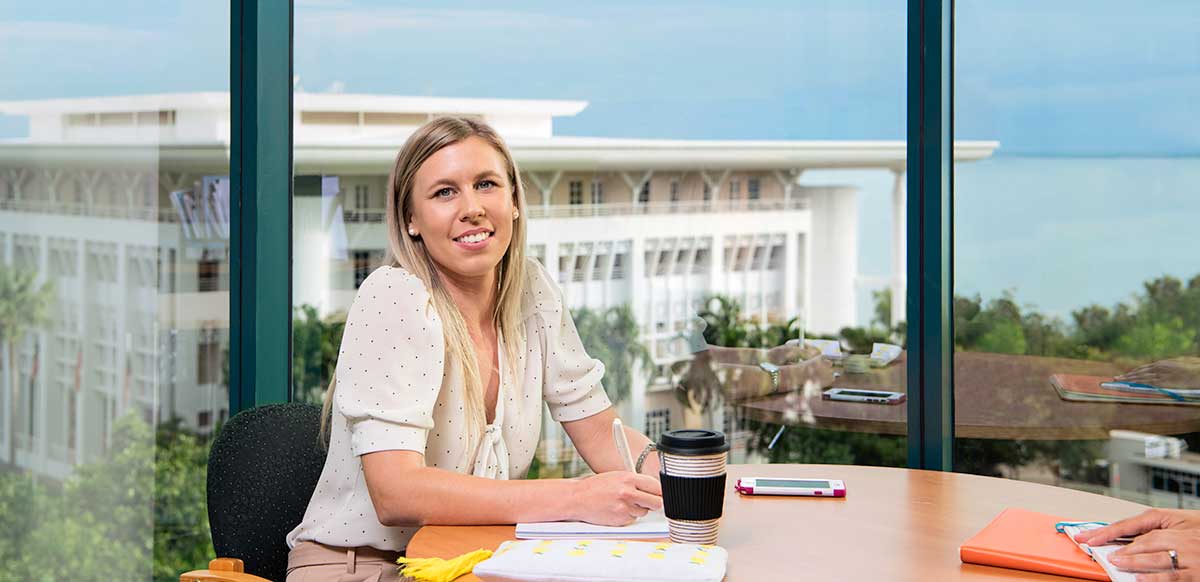 Angela Millar sitting at a table