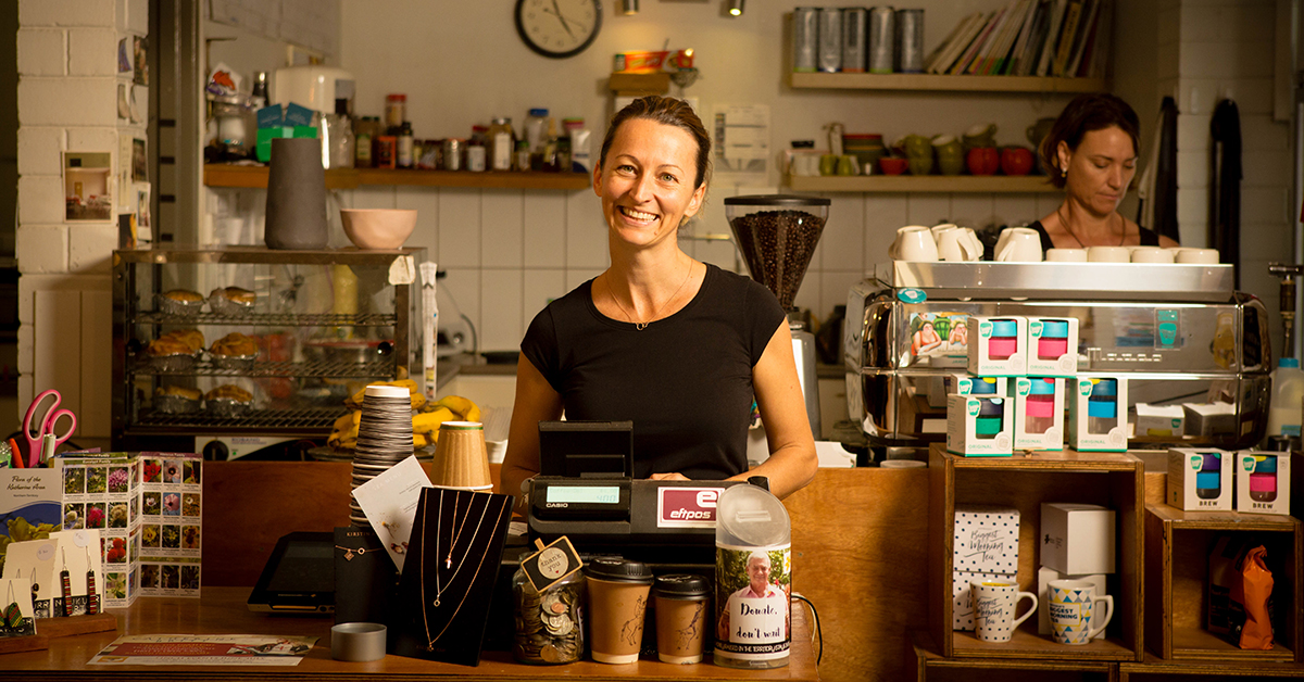 Two women working in a cafe