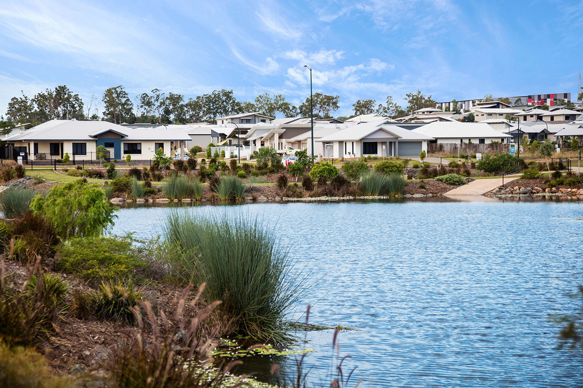 Lake with houses in the background