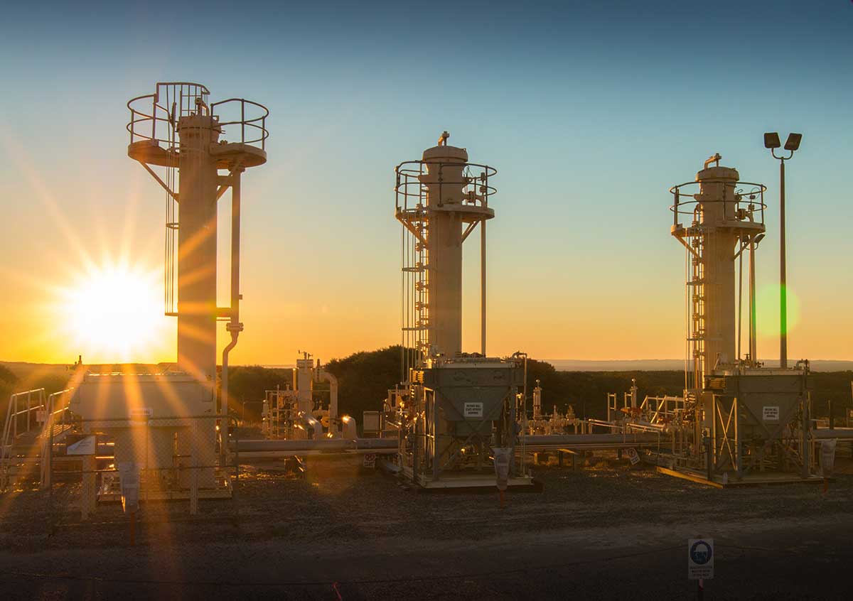 Land based gas facility at sunset