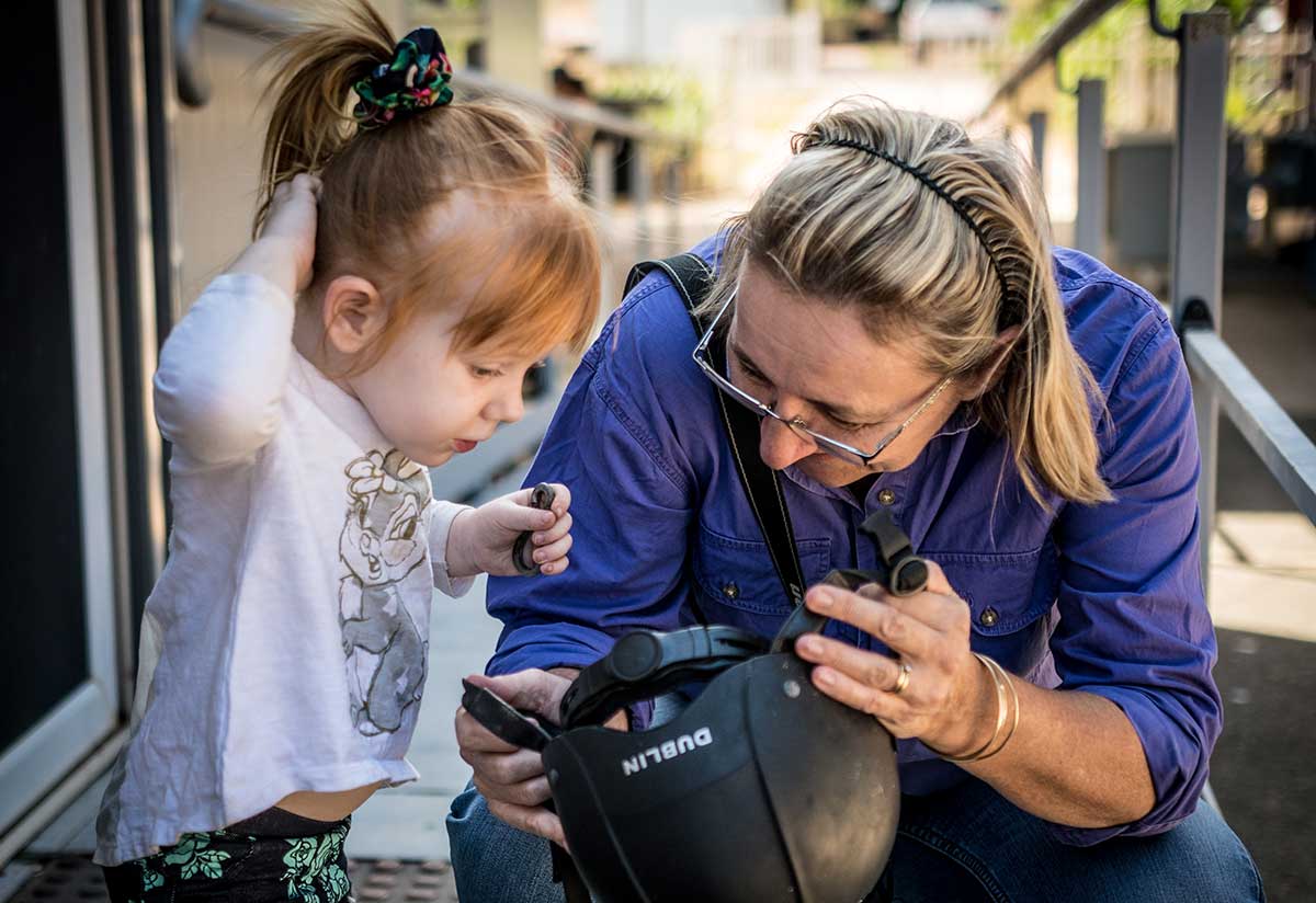 Riding for the Disabled employee with a young girl