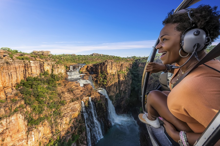 Woman sightseeing in helicopter