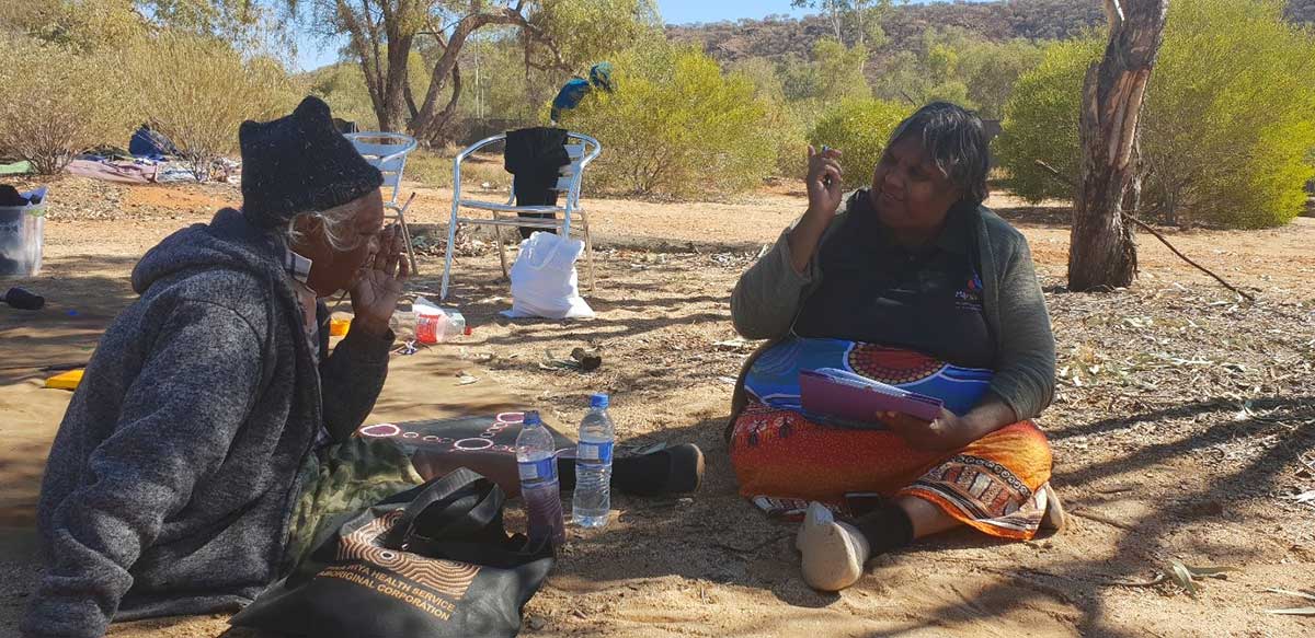 Vanessa Davis surveying Aboriginal man