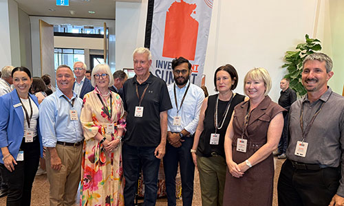 Group shot of investors attending Investment Summitt